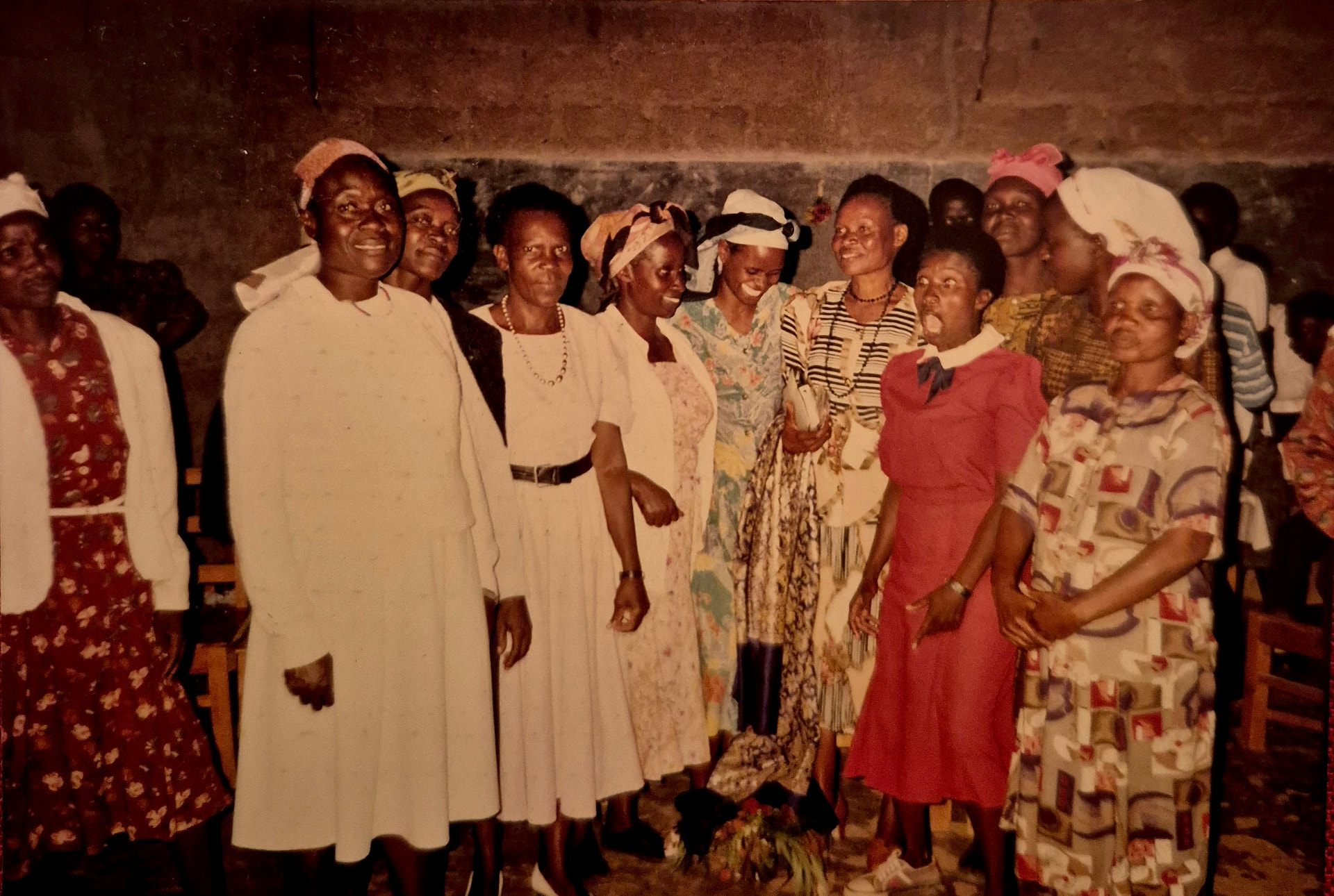 Mary Munei, front row third from right, celebrating with colleagues and community members at her retirement party at Makutano Primary School, Bungoma